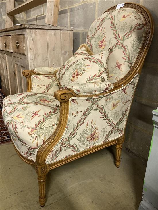 A Louis XV style carved walnut framed fauteuil